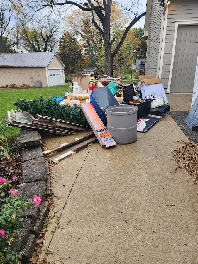 Dumpster being loaded with debris for 3 Yard Dumpster Rental in Colchester